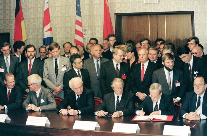 The signing of the Treaty on the Final Settlement with Respect to Germany, which reunited the two German states, on 12 September 1990. (Photo by Vitaly Armand/AFP via Getty Images)