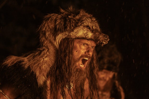 Alexander Skarsgård as Viking prince Amleth in The Northman, wearing a bearskin
